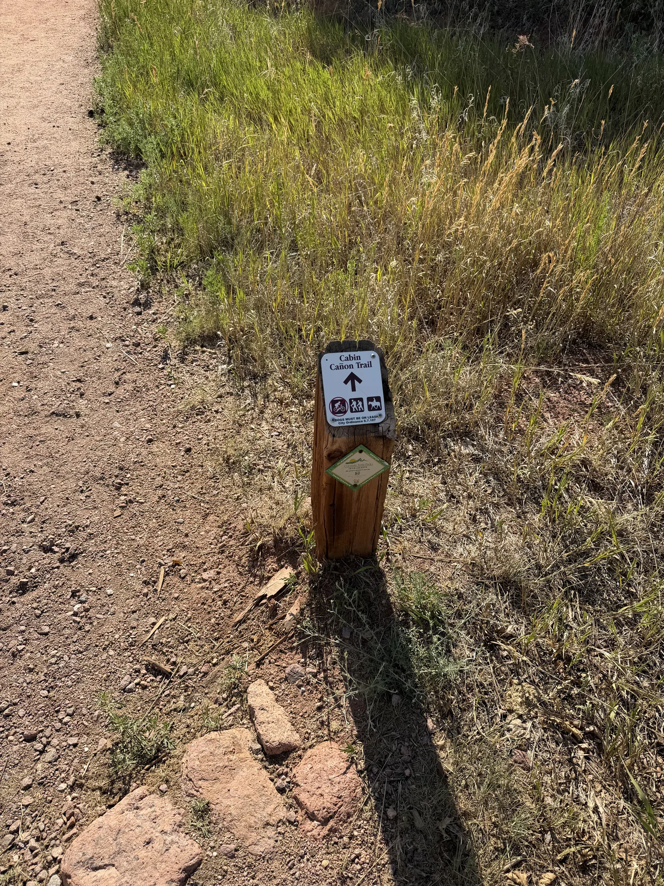Cabin Canyon Trail marker beside the dirt path